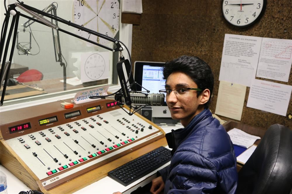 A student works at the high school radio station WKWZ